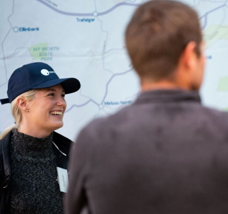 Group of people in front of a large map